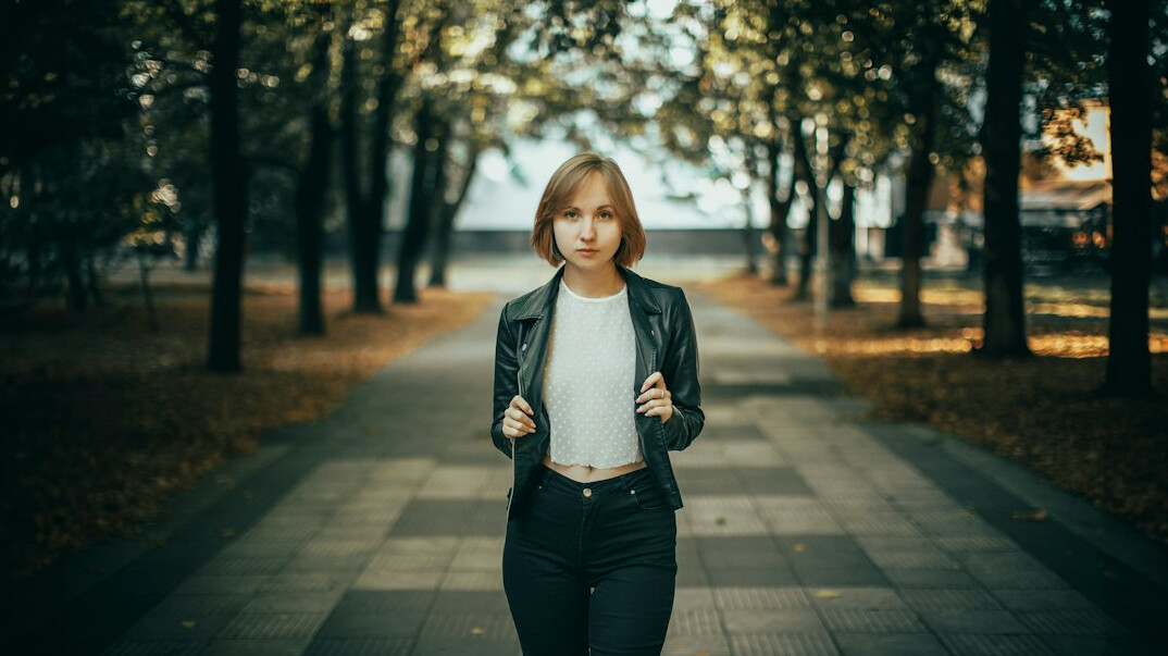 person walking confidently outdoors