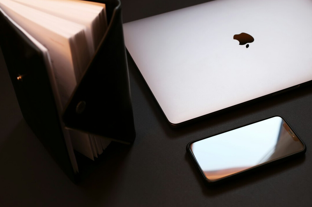 Calm workspace with a notebook and a phone on a table