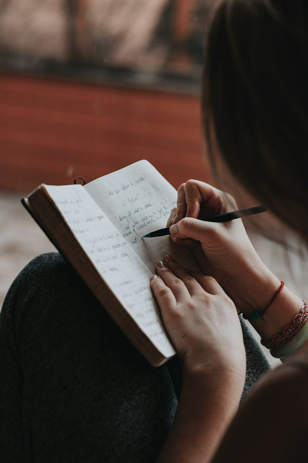 person journaling emotions